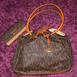 Authentic Michael Kors bag and matching wallet.